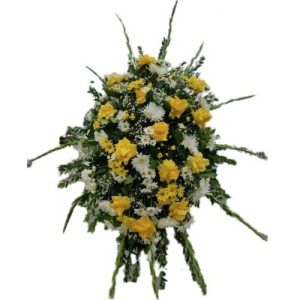 Sympathy arrangement with yellow and white flowers