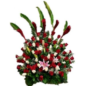 Sympathy flowers arrangement with red roses, Lilies and green
