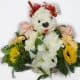 Basket bouquet with a white dog made it with flowers