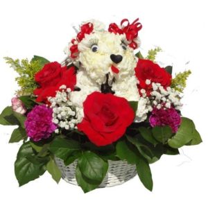 Basket bouquet with a white dog made it with flowers