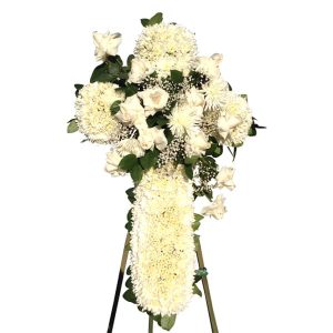 White cross made with white flowers, sympathy flowers