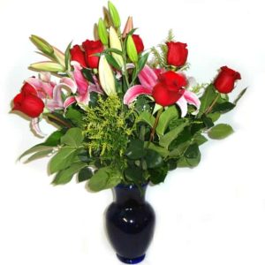 Flowers in a vessel with 12 Roses, 3 Lilies.