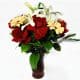 Flower in a vessel with 7 Roses, 4 Gerberas, 2 Lilies
