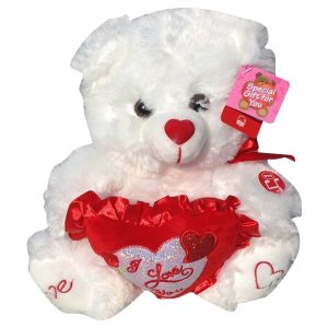 White purple teddy bear with a heart that said Love You