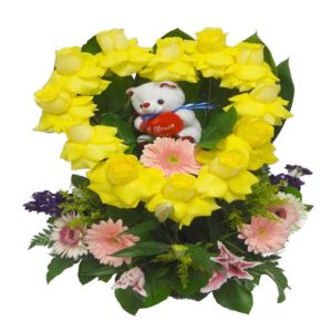 Yellow Heart with teddy bear inside with 13 Roses, 3 Lilies, 5 Gerberas, 2 Stalks and 1 Teddy Bear