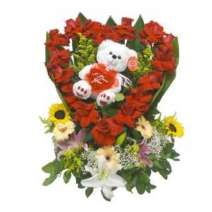 Teddy bear inside of a heart of red roses with 18 Roses, 2 Sunflowers, 3 Gerberas, 3 Lilies, 1 Teddy Bear