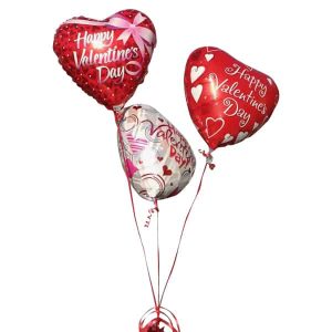 Red and white hearth shaped balloons with the word Happy Valentines Day