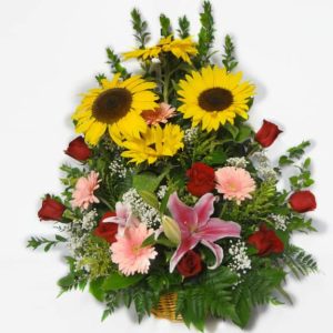 Bouquet in a basket with 8 Roses, 3 Sunflowers, 4 Gerberas Daisies, Baby Breath, Lemon Leaves.