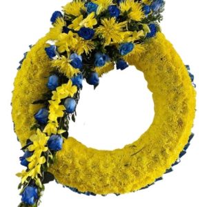 Funeral Arrangement ROUND YELLOW FLOWERS WITH GREEN YEALLOW AND BLUE FLOWERS BAND