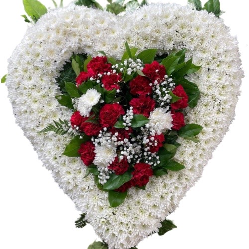 Funeral Arrangement white flowers heart with red and white roses on the center