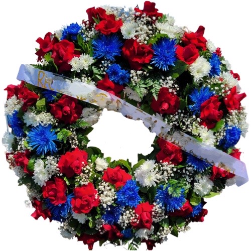 Funeral Arrangement Round with red, blue and white flowers with green background